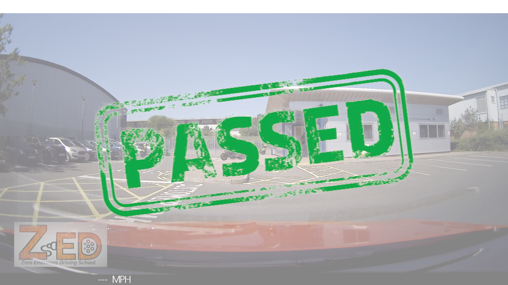 A green distressed rubber stamp graphic reading 'PASSED' overlaid on a faded background of a car windshield and an outdoor parking lot. A watermark logo for ZED Driving Tests and Training School is visible in the bottom-left corner.