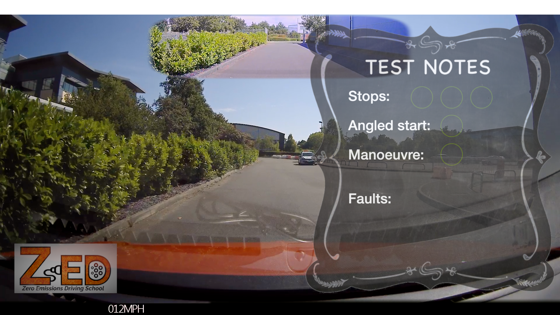 A dashboard camera view from inside a vehicle showing a driveway or road with green hedges and houses, overlaid with a dark decorative panel labeled 'TEST NOTES' and a ZED logo in the lower left.