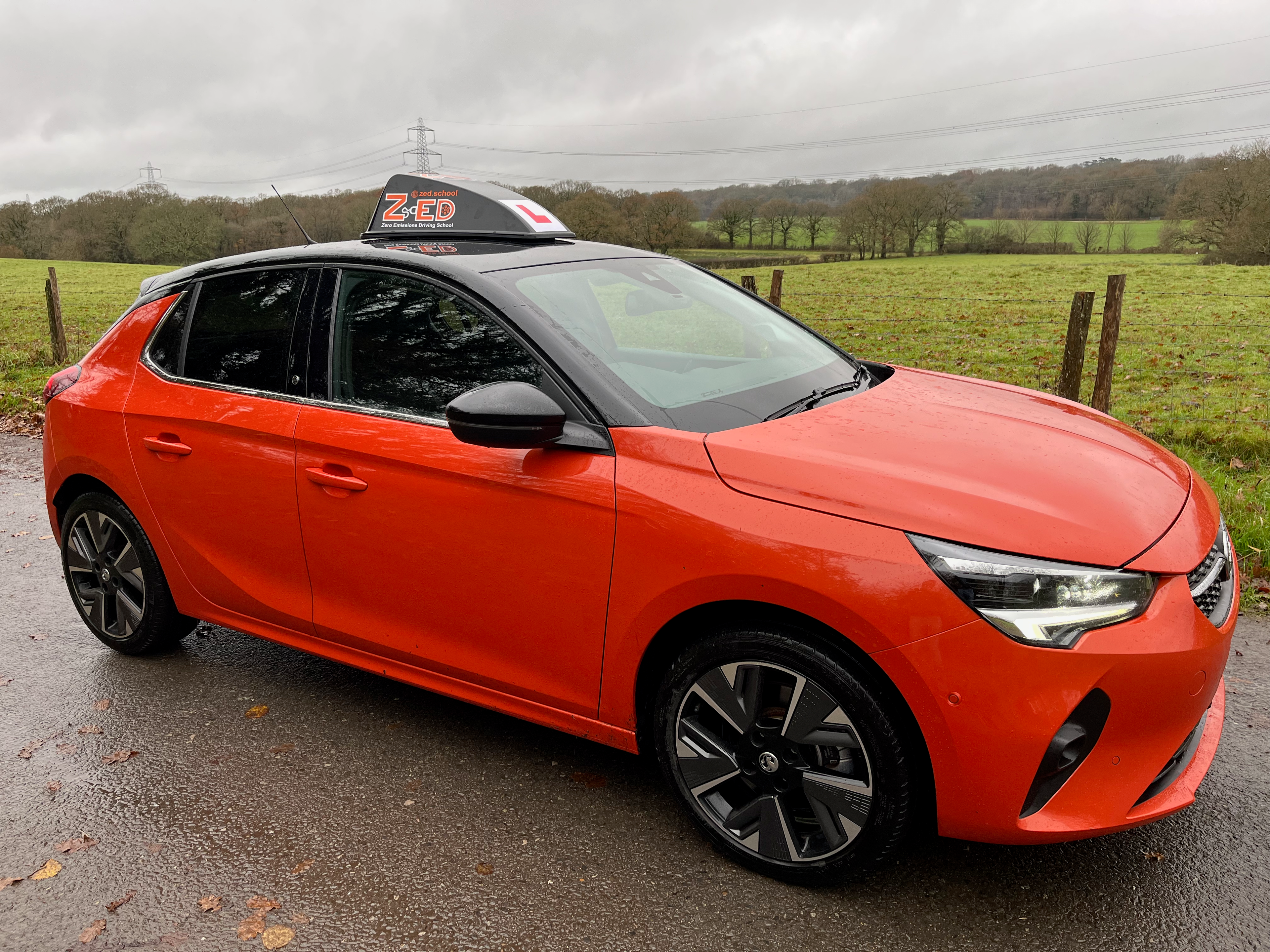 A photo of the ZED School training car, with the driving school roofbox sign
